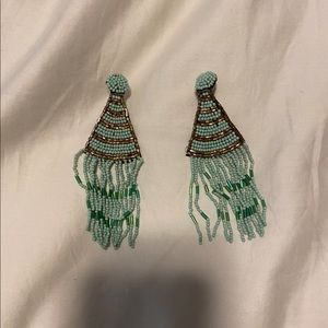 Beaded sea foam green tassel statement earrings. Turquoise Party hats fringe